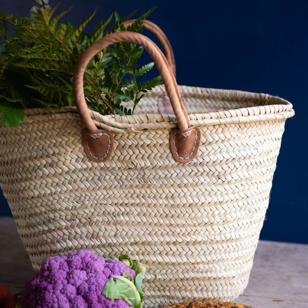 French Market Basket Tote on a table at Addison West
