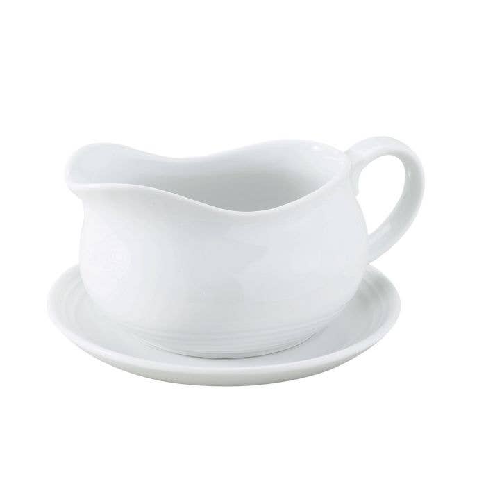 White Porcelain Gravy Boat With Saucer on a white background at Addison West