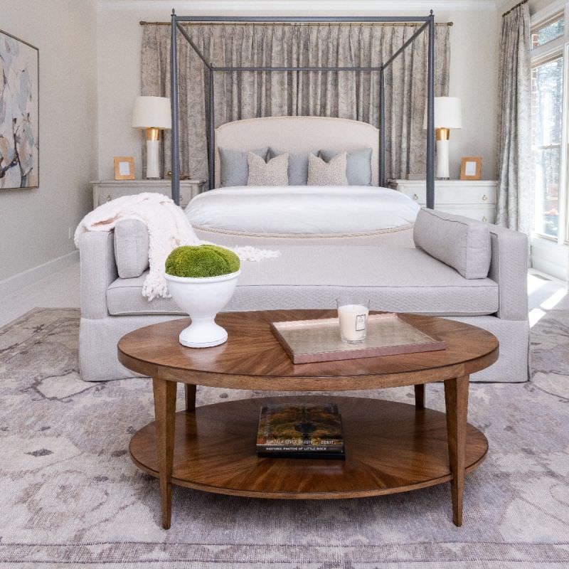 Stafford Oval Cocktail Table in Hazelnut Finish in a bedroom at Addison West
