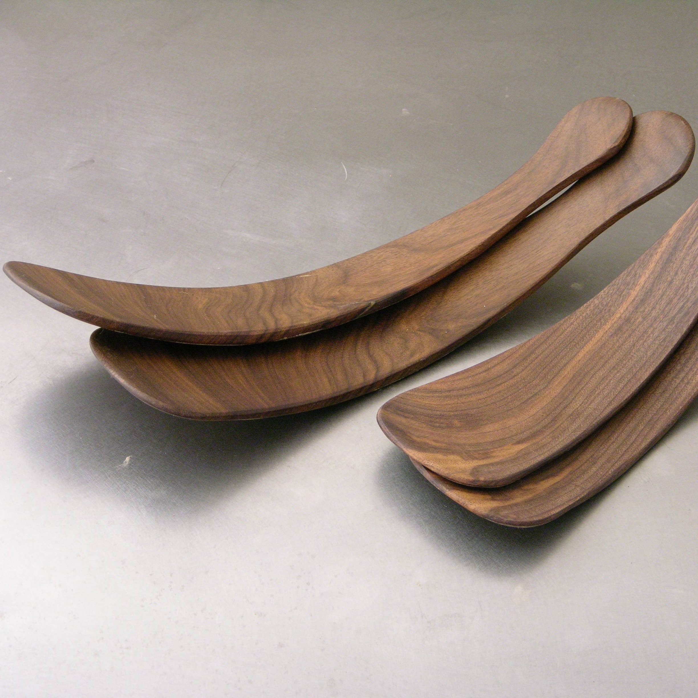 Petermans boards 11.5" Black Walnut Salad Tossers on a grey background at Addison West