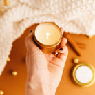 Eucalyptus + Lavender Mini Soy Candle held by a model at Addison West