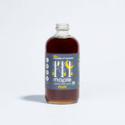 Organic Dark Maple Syrup on a white background at Addison West