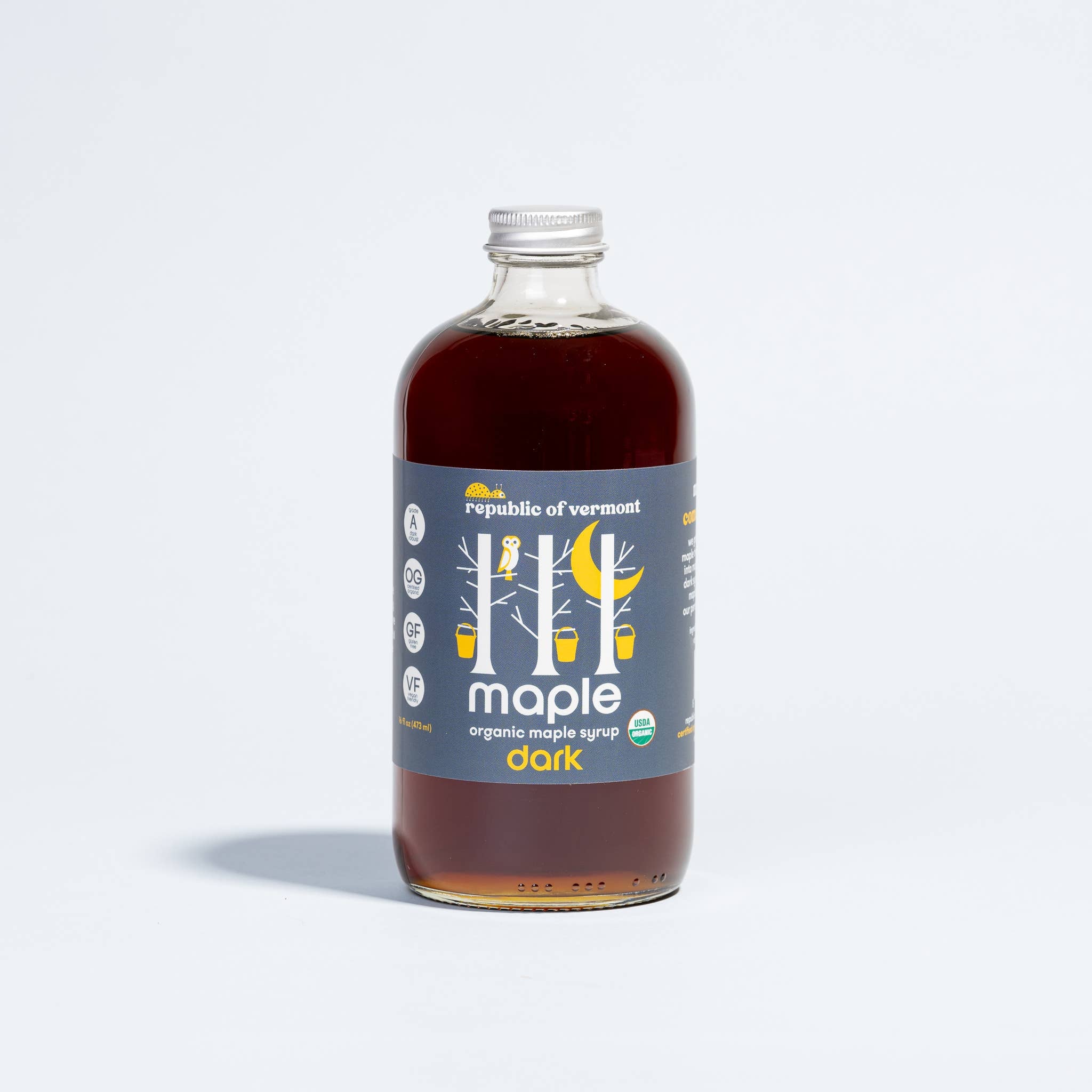 Organic Dark Maple Syrup on a white background at Addison West