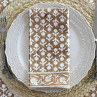Charlotte Caramel Napkins, Set of 4 on a table at Addison West