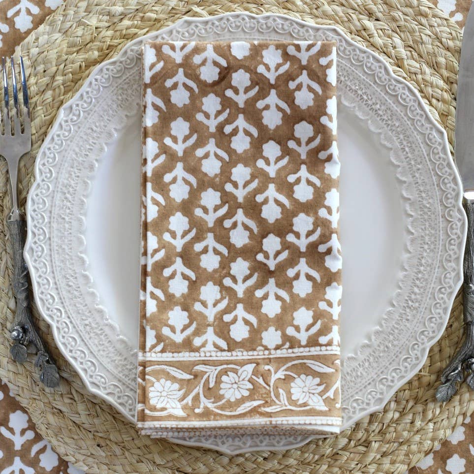Charlotte Caramel Napkins, Set of 4 on a table at Addison West
