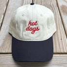 Hot Dog Baseball Hat in Khaki on a wood table at Addison West