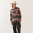 Male model wearing the Brixton Men's Bowery Flannel in Multi Shadow on plain background.