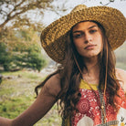 Skiff Sun Hat in Natural on model at the Addison West.