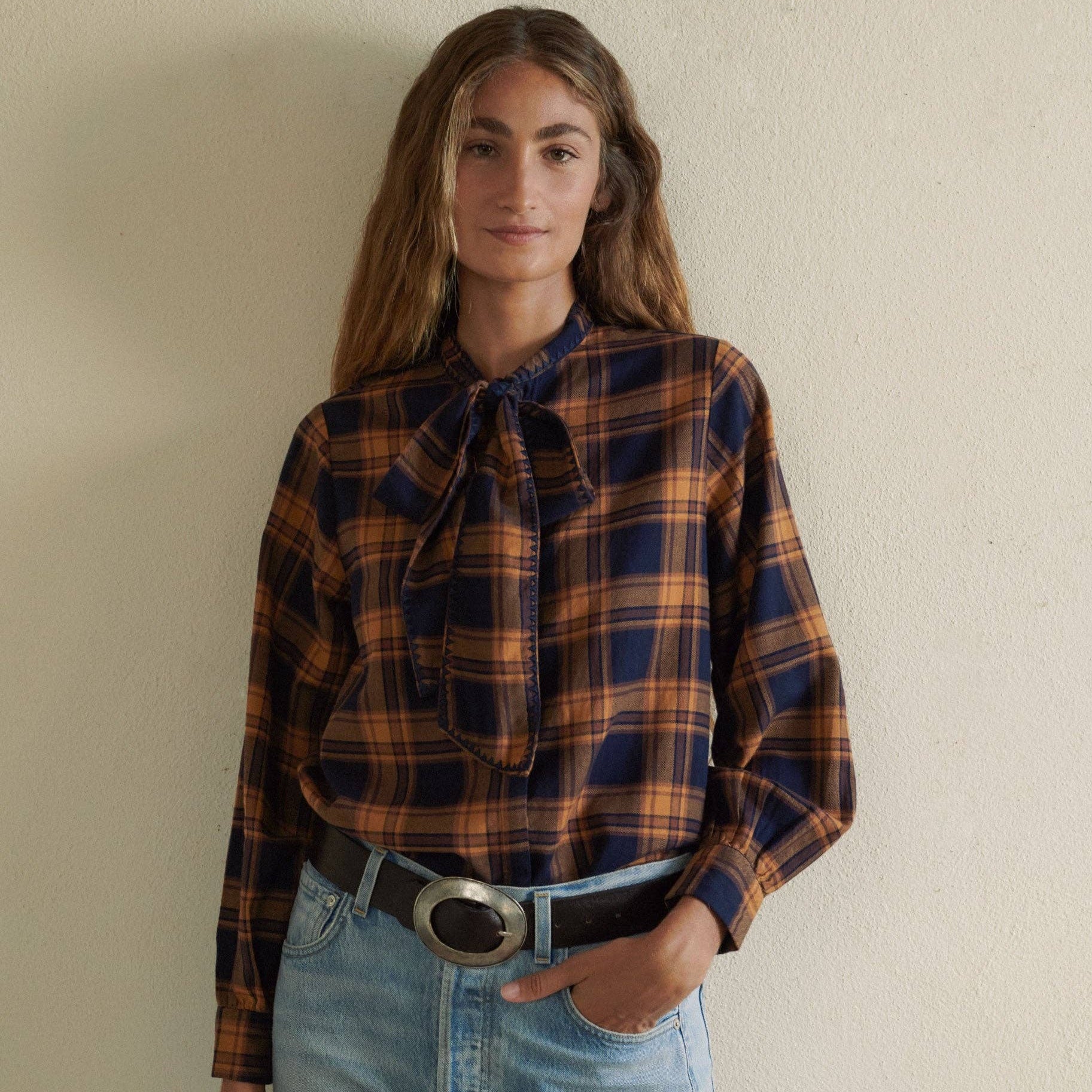 Lily Blouse in Navy on a white background at Addison West