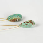 Commonform Aurora Earrings in Turquoise on white background at the Addison West.