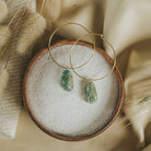 Commonform Aurora Hoops in Turquoise on textured background at the Addison West.