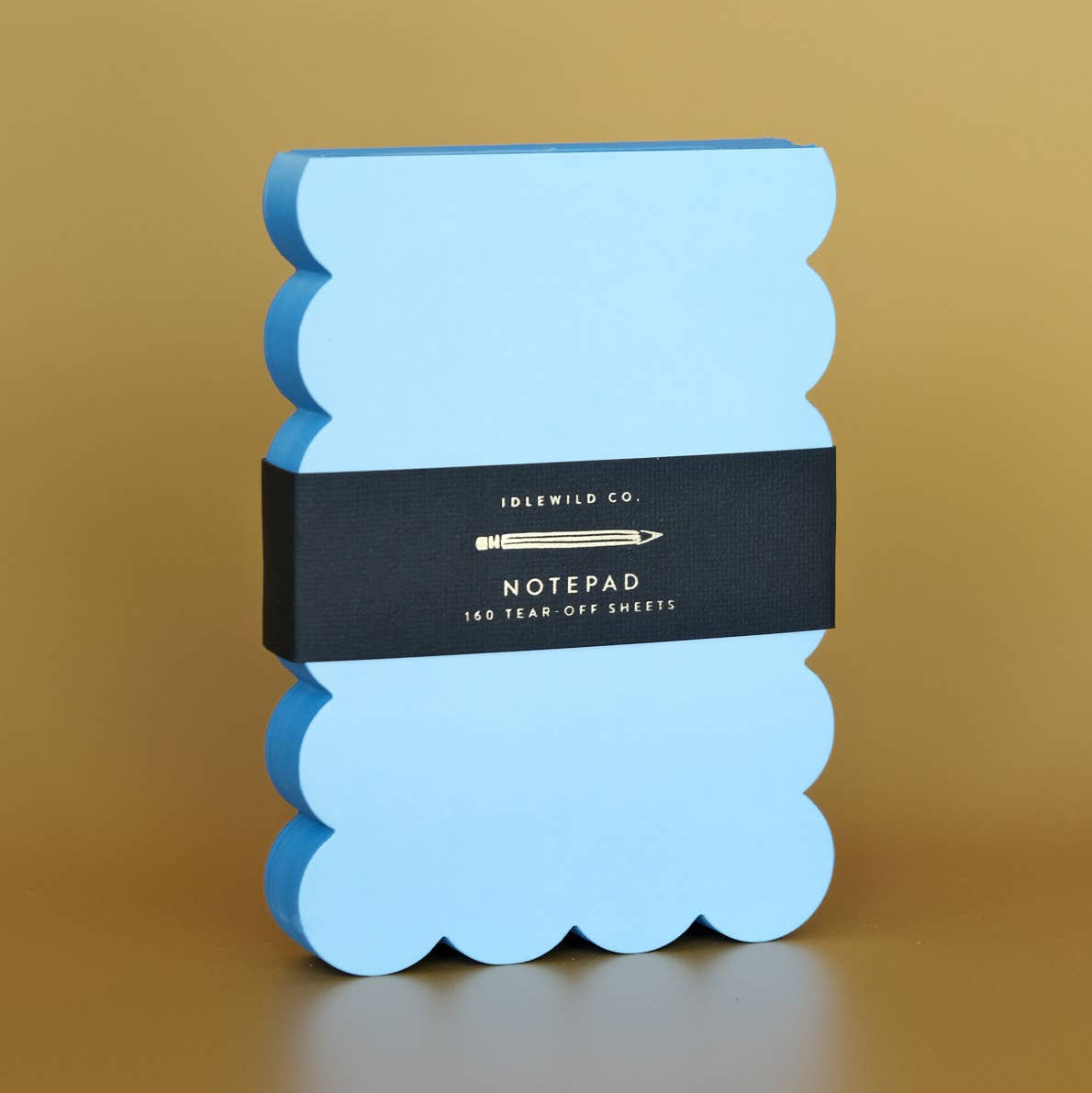 Scalloped Shaped Notepad in Aqua And Blue on a beige background at Addison West