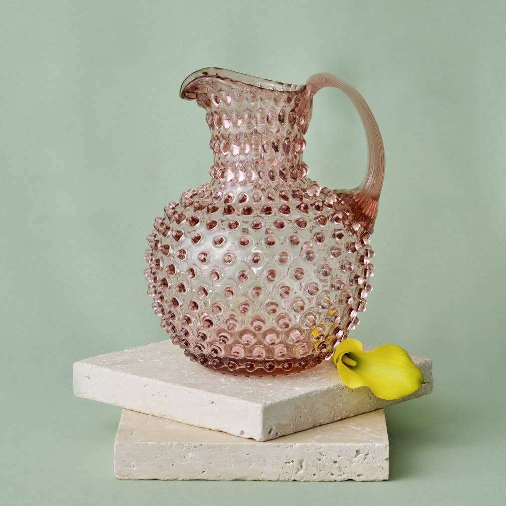Hobnail Glass Pitcher in Night Iris on a green background at Addison West