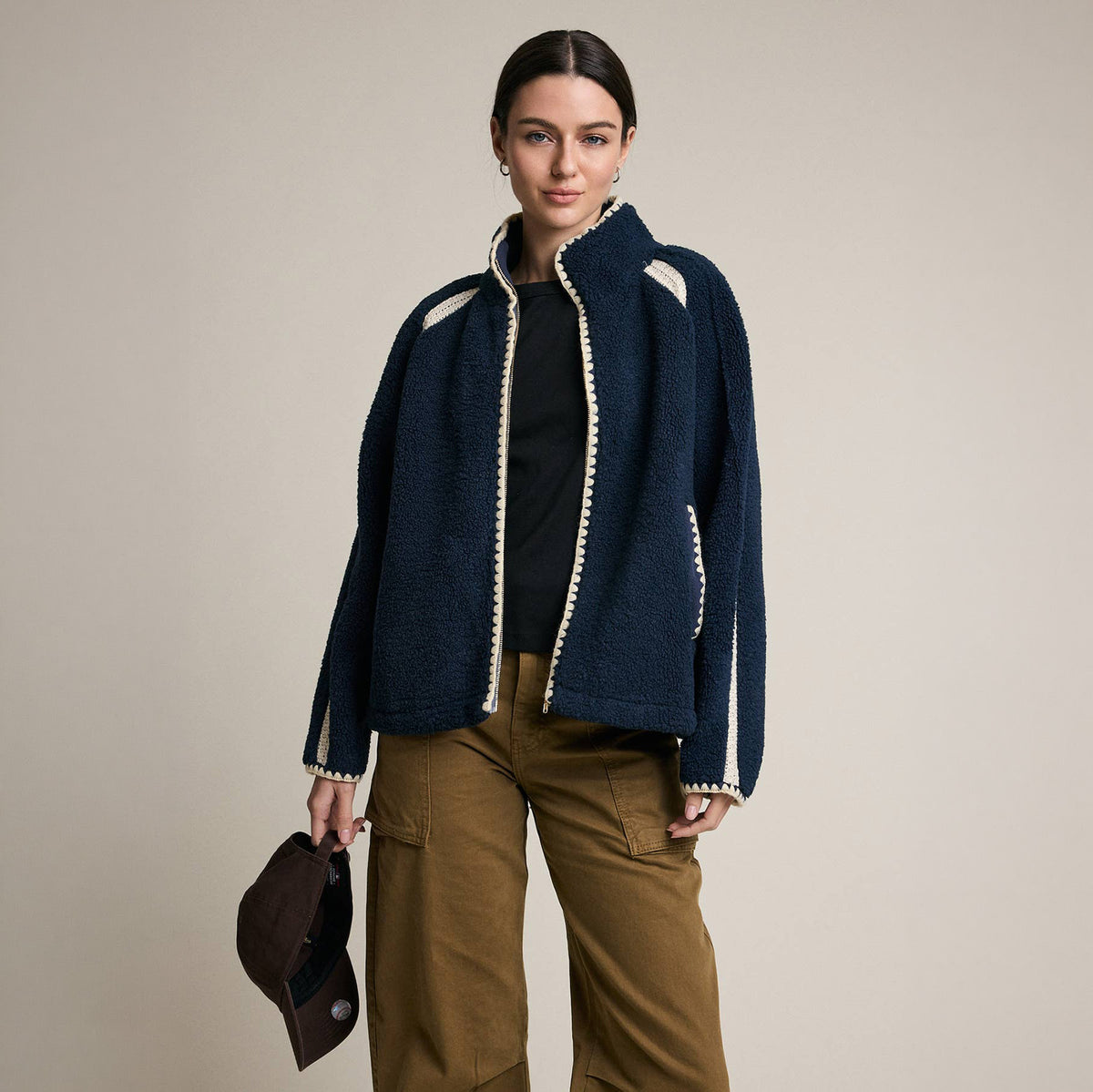 Contrast Trim Sherpa Zip-Up Jacket in Navy on a model at Addison West