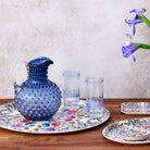 Hobnail Glass Pitcher in Atlantic Blue on a table at Addison West