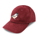 Chickadee Corduroy Hat in Merlot on a model outside at Addison West
