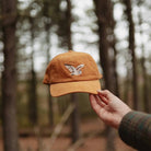 Barn Owl Corduroy Hat in Amber on a model outside at Addison West