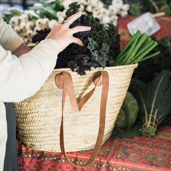 French Market Basket Tote with Shoulder Strap and model outside at Addison West