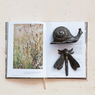 Cast Iron Snail on a book at Addison West