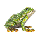 Decorative frog figurine with green gemstones on a white background