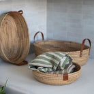 Seagrass & Hyacinth Woven Basket on a table at Addison West