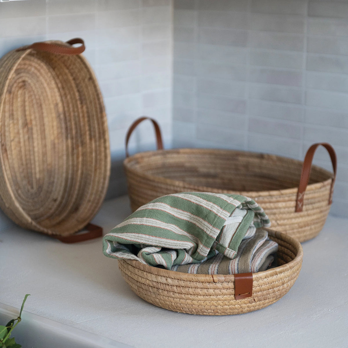 Seagrass & Hyacinth Woven Basket on a table at Addison West