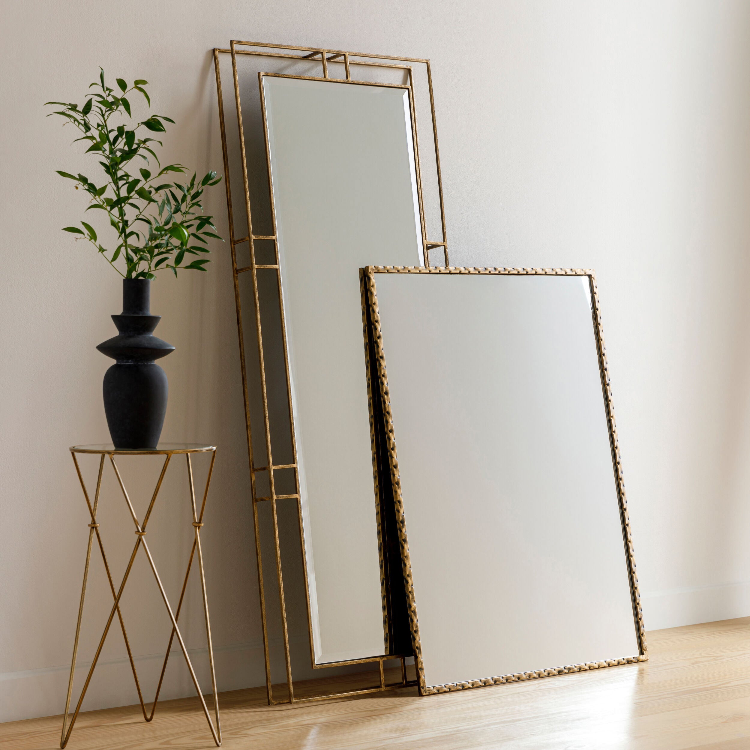 Alchemist Accent Mirror on a white wall at Addison West