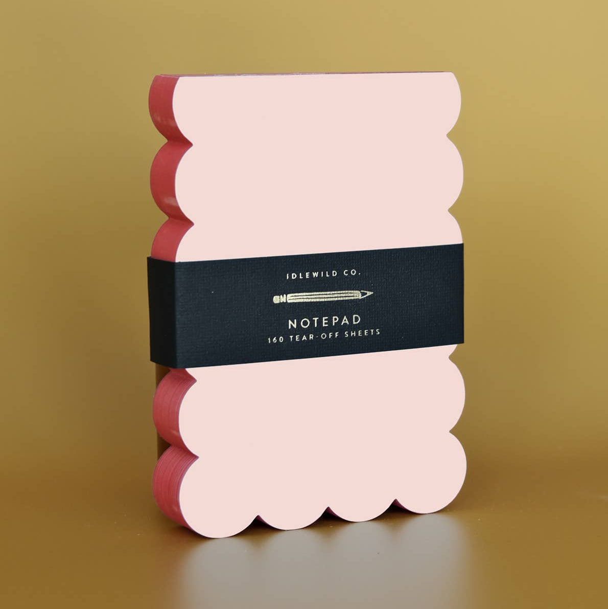 Scalloped Shaped Notepad in Peach And Persimmon on a beige background at Addison West