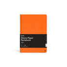 Karst A5 Hardcover Lined Notebook in Tangerine on a white background at Addison West
