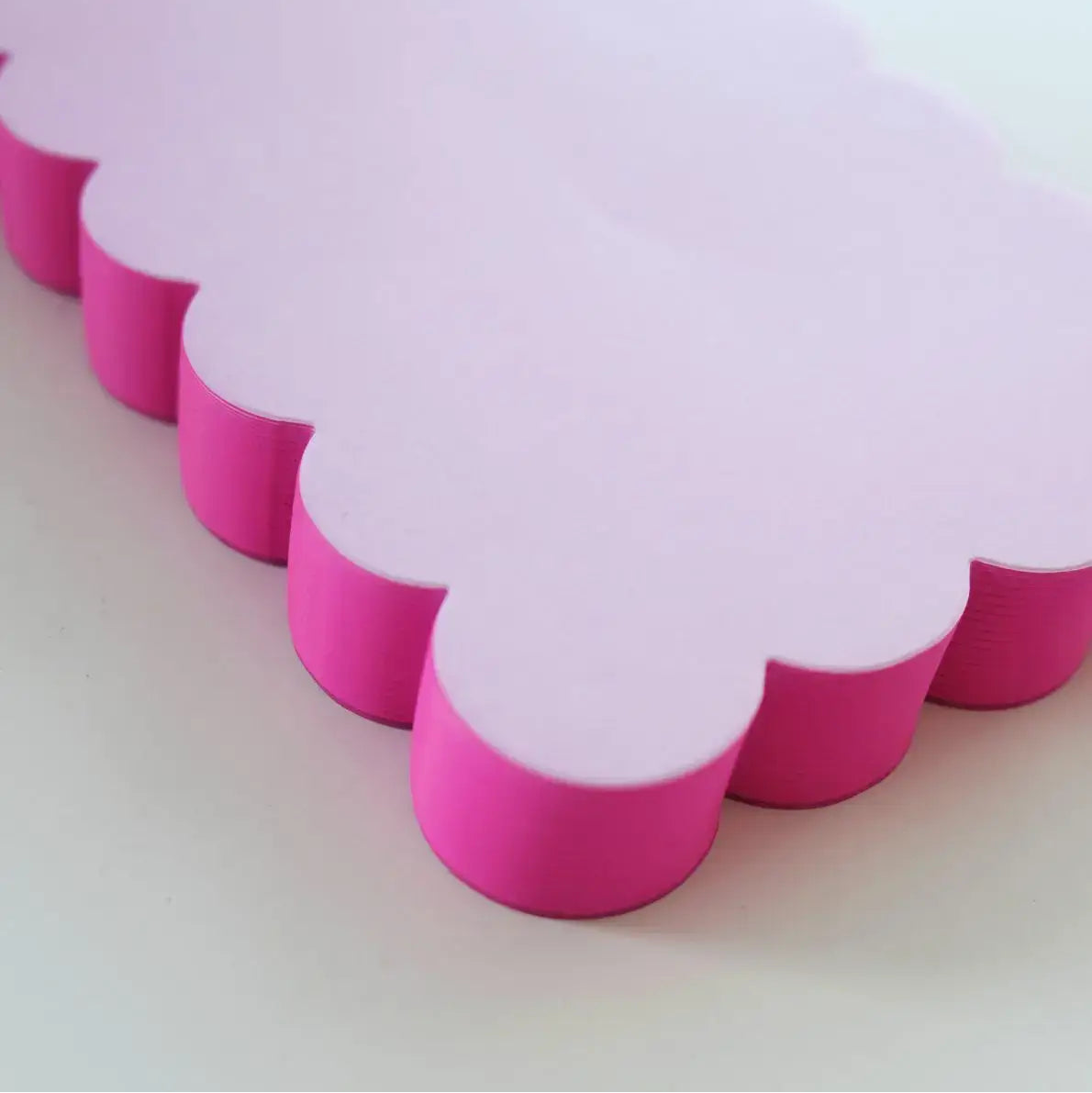 Scalloped Shaped Notepad in Lilac And Hot Pink on a beige background at Addison West