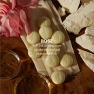 Daily Pebble | Deep Moisturizing Solid Bath & Shower Oil on a table at Addison West