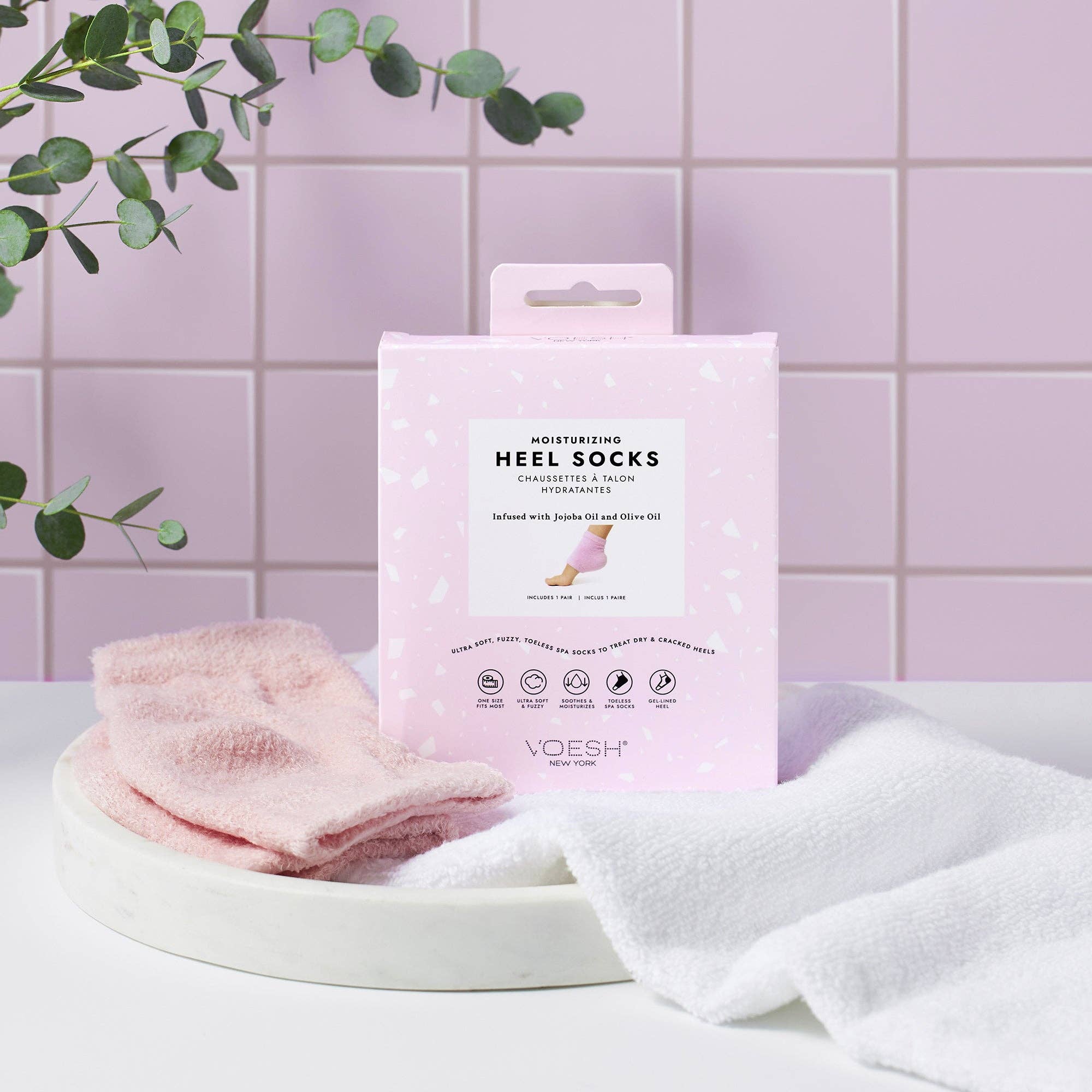 Moisturizing Heel Socks in Pink on a pink background at Addison West