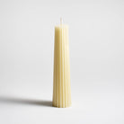 Greentree 8" Petite Pillar Candle in Cream on a white background at Addison West
