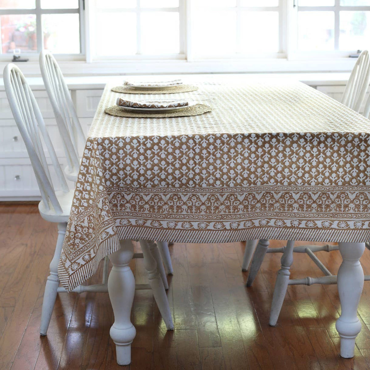 Charlotte Caramel Tablecloth on a table at Addison West