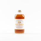 Bottle of Hot Toddy with a label on a white background