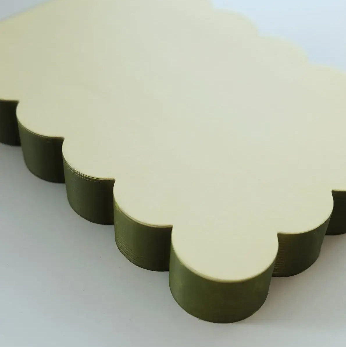 Idlewild Co. Scalloped Shaped Notepad in Chartreuse And Olive on a beige background at Addison West