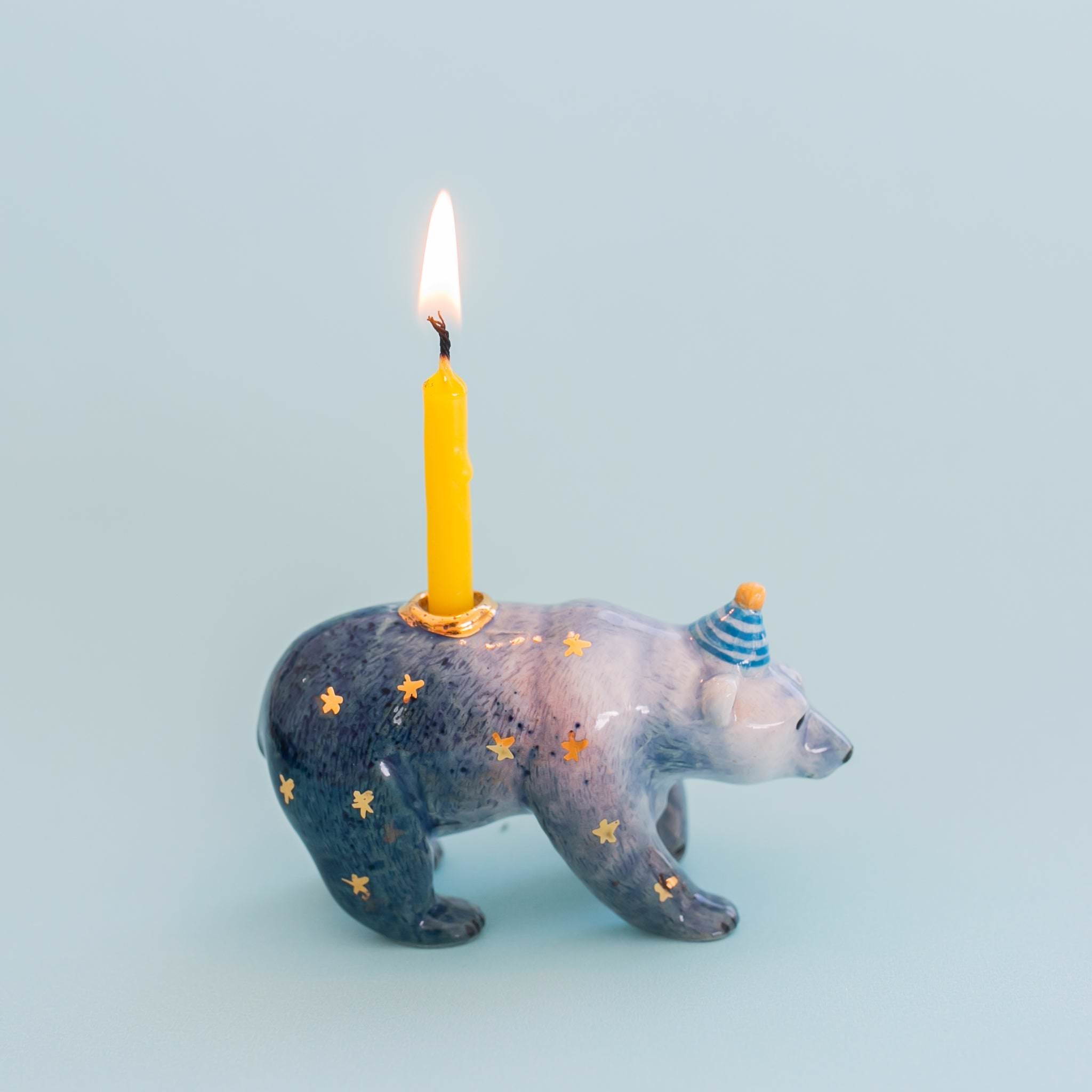 Camp hollow Galaxy Bear Cake Topper on a blue background at Addison West