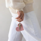 Graf Lantz Merino Wool Heart Key Fob in Rock Salt on a white background with a model at Addison West