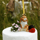 Camp Hollow Highness Hare Cake Topper on a cake at Addison West