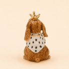 Camp Hollow Highness Hare Cake Topper on a beige background at Addison West