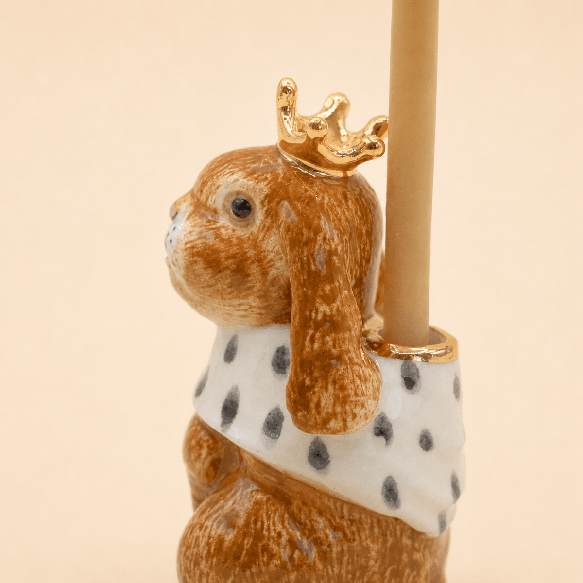 Camp Hollow Highness Hare Cake Topper on a beige background at Addison West