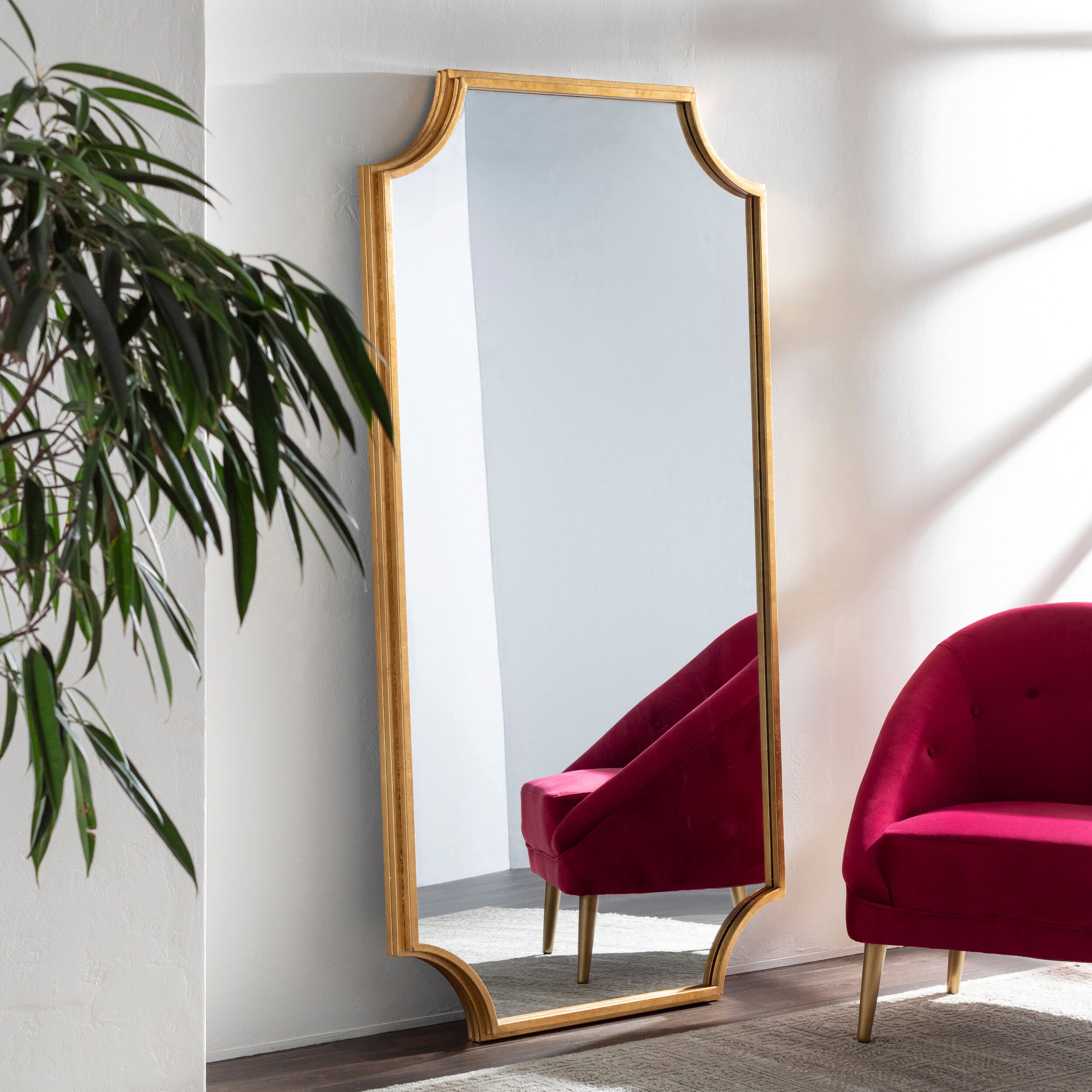 Joslyn Full Length Mirror on a white wall in a living room at Addison West