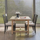 Woodbridge Furniture Forever Table in a dining  room at Addison West