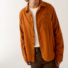 Brixton Men's Hasting LW Flannel in Caramel shown on male model on plain background.