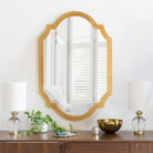 Norway Accent Mirror on a white wall above a table at Addison West