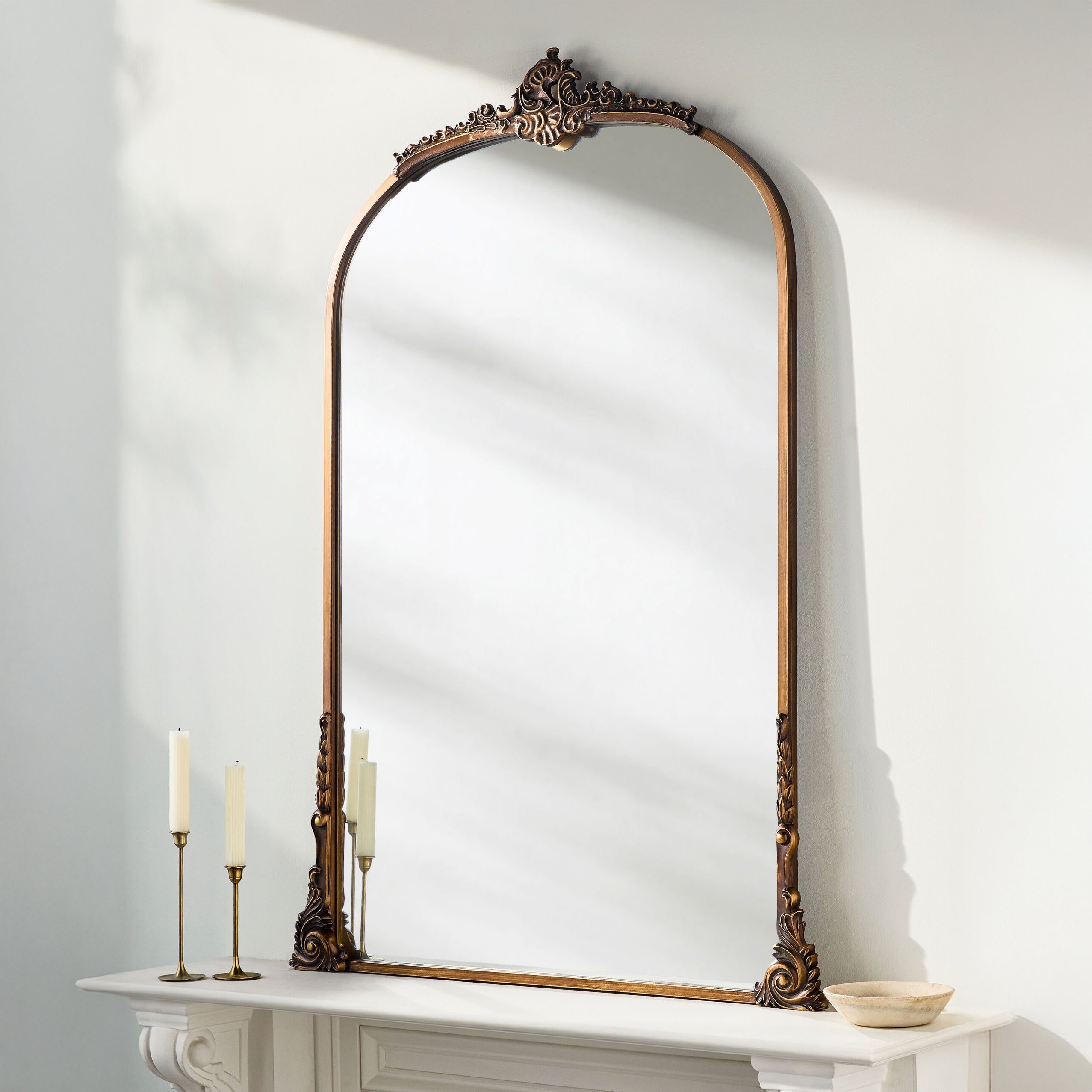 Nightingale Accent Mirror on a white mantle at Addison West