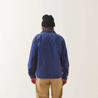 Male model wearing Brixton Men's Century Overshirt in Blue & Navy Shadow on plain background.