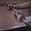 Simon Pearce Medium Burlington Hurricane being crafted by a glass blower at Addison West