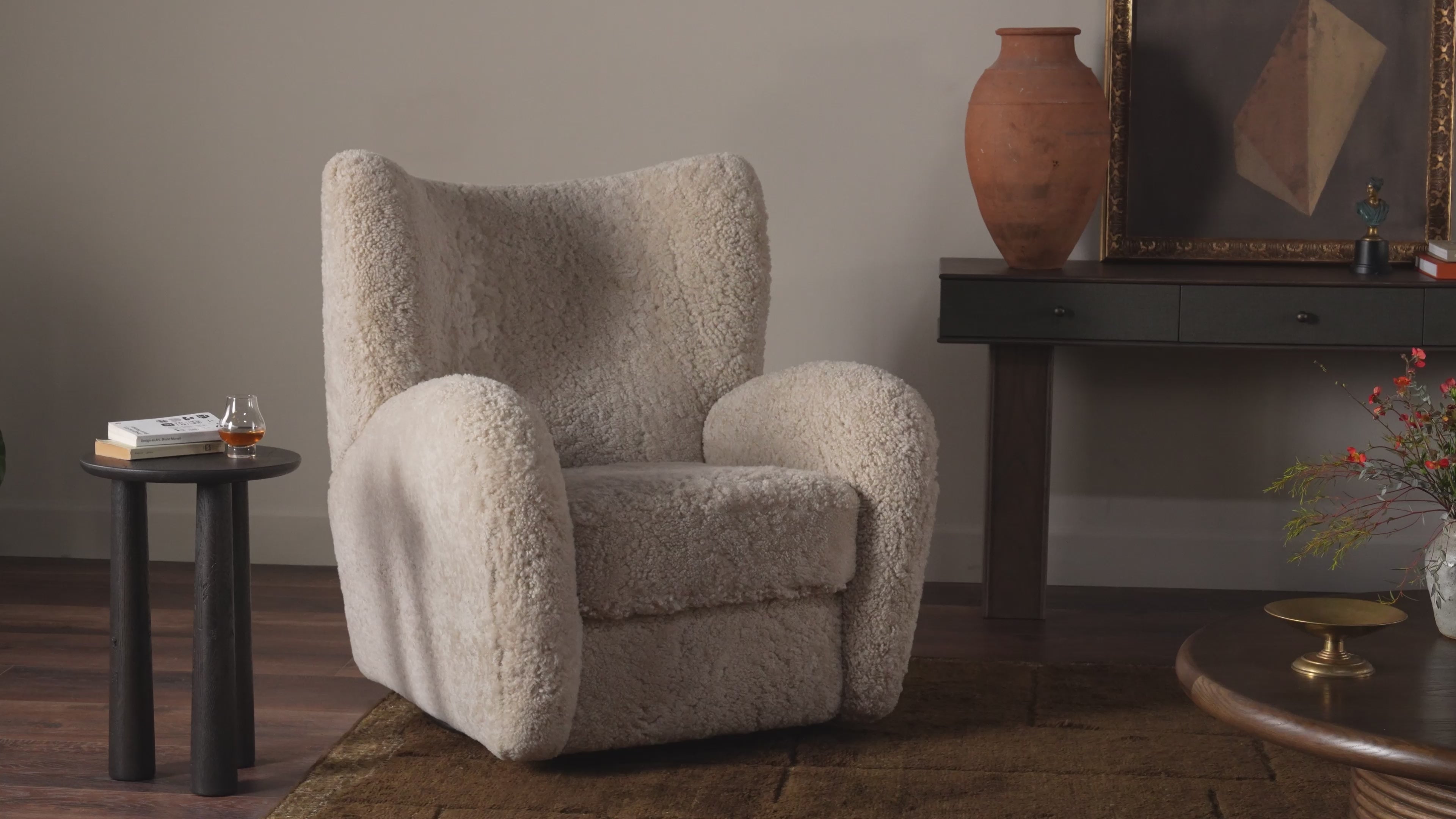 Four Hands Amelie Swivel Recliner in Beige Shearling in a living room  at Addison West