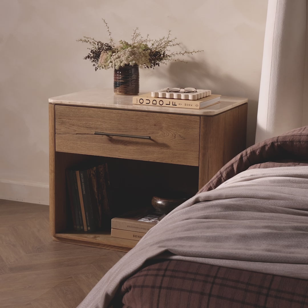 Four Hands Raleigh Nightstand in Cappuccino Marble in a bedroom at Addison West